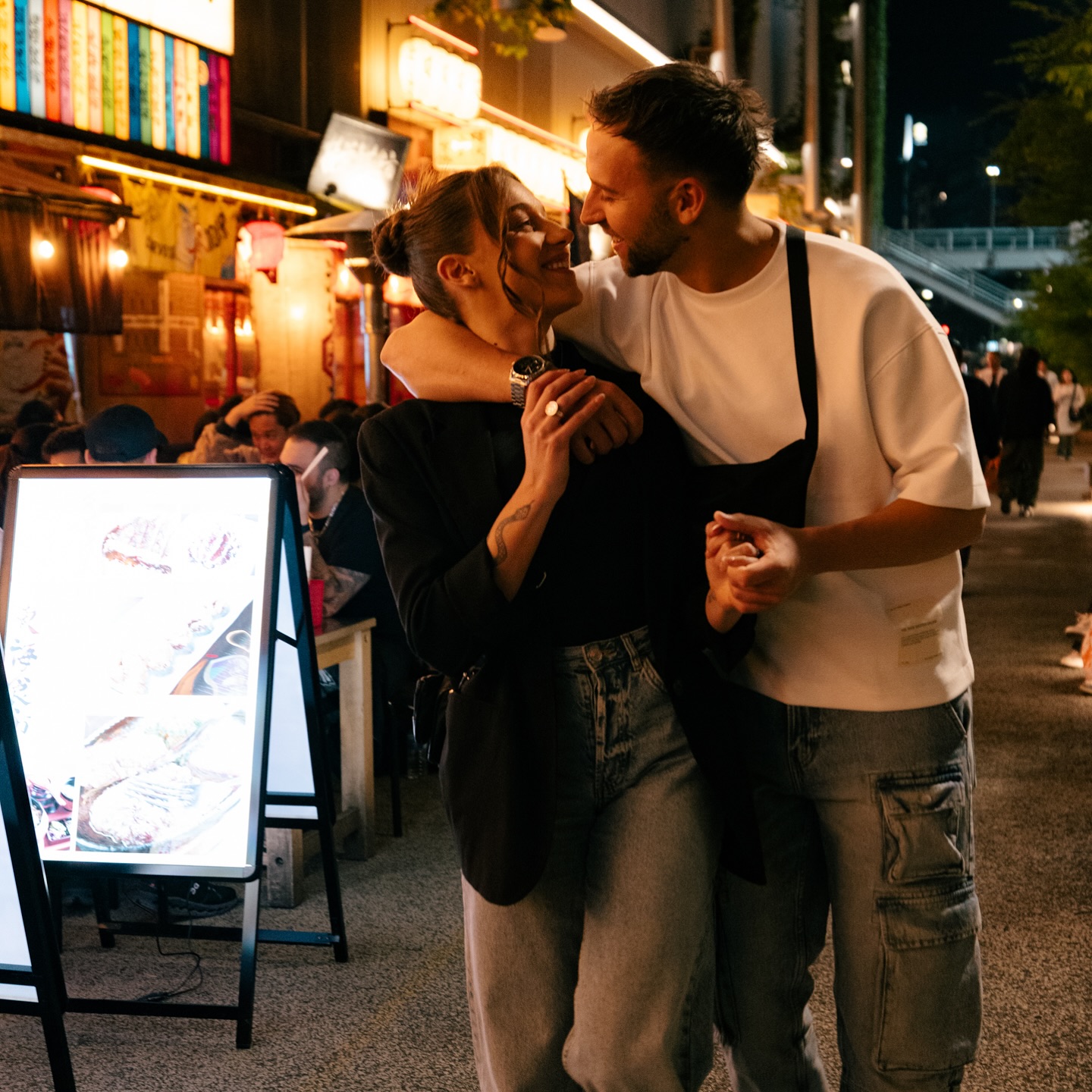 Couple photographed in Tokyo at night